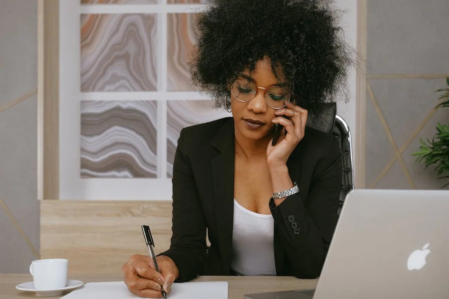 Photo of a business woman on the phone -- Upselling or cross-selling